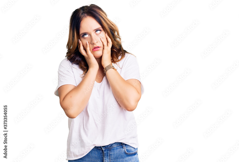 Young beautiful caucasian woman wearing casual white tshirt tired hands covering face, depression and sadness, upset and irritated for problem Young beautiful caucasian woman wearing casual white tshirt tired hands covering face, depression and sadness, upset and irritated for problem