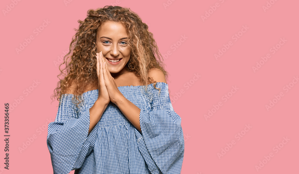 Beautiful caucasian teenager girl wearing summer dress praying with hands together asking for forgiveness smiling confident. Beautiful caucasian teenager girl wearing summer dress praying with hands together asking for forgiveness smiling confident.