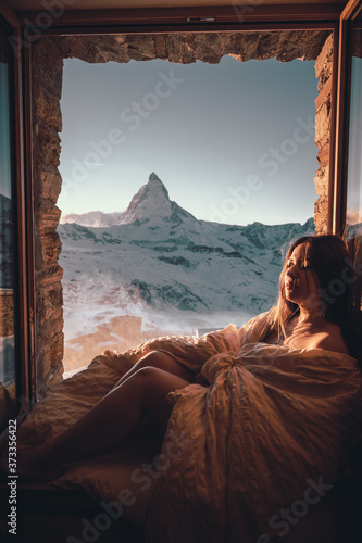 Woman tourist selfie near the Matterhorn mountain.Famous popular touristic place in the world.