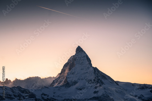 Scenic view on snowy Matterhorn peak in sunrise, Switzerland.