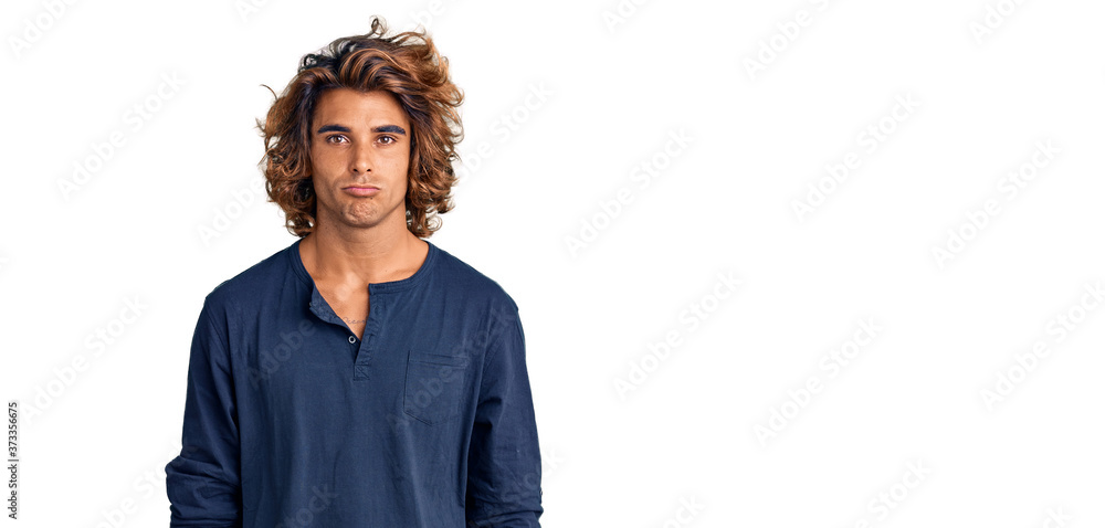 Young hispanic man wearing casual clothes depressed and worry for distress, crying angry and afraid. sad expression. Young hispanic man wearing casual clothes depressed and worry for distress, crying angry and afraid. sad expression.