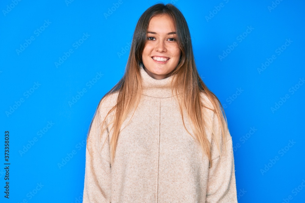 Beautiful caucasian woman wearing wool winter sweater with a happy and cool smile on face. lucky person. Beautiful caucasian woman wearing wool winter sweater with a happy and cool smile on face. lucky person.