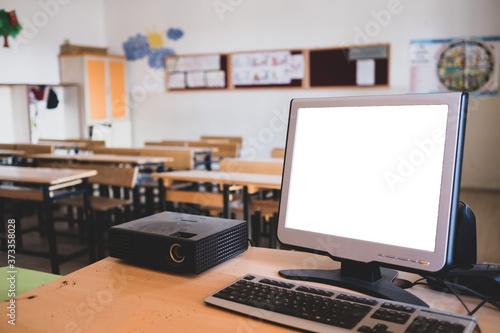 empty classroom and desktop computer