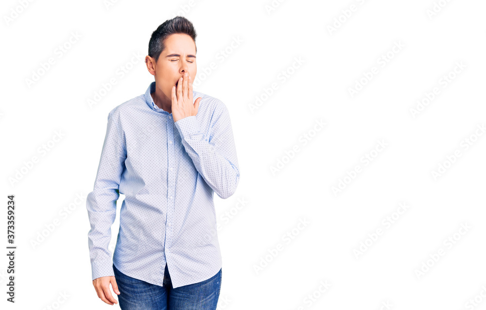 Fototapeta premium Young woman with short hair wearing business clothes bored yawning tired covering mouth with hand. restless and sleepiness.