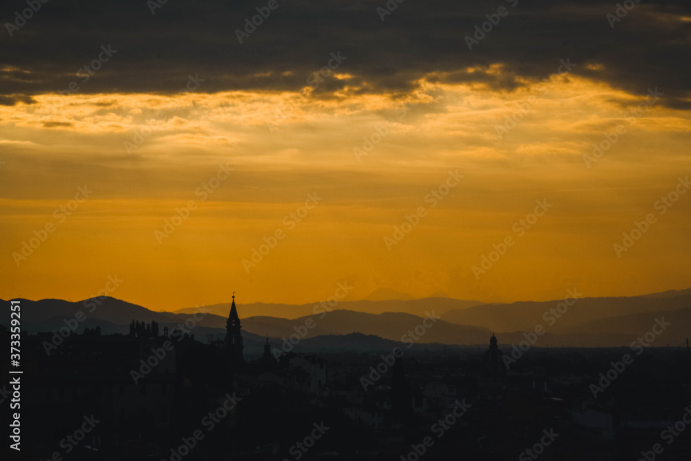 Incredible Toscana orange sunset with silhouette of the building