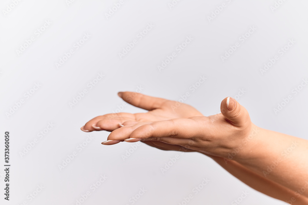 Hand of caucasian young woman with flat palm presenting product, offer and giving gesture, blank copy space Hand of caucasian young woman with flat palm presenting product, offer and giving gesture, blank copy space