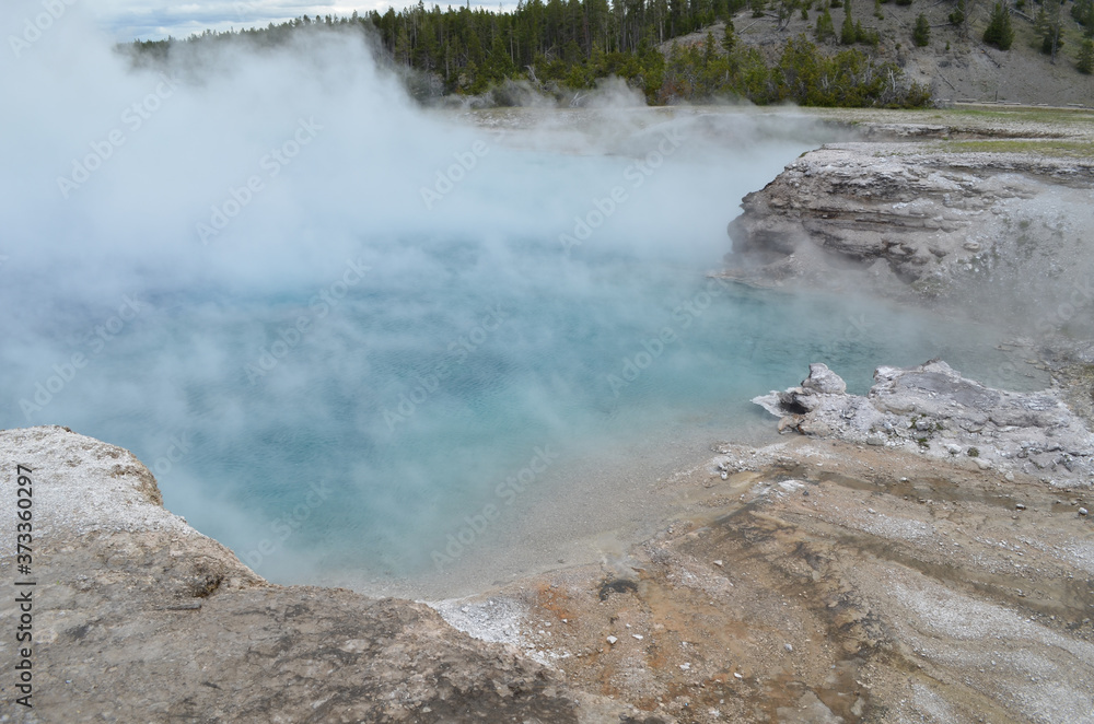 Late Spring in Yellowstone National Park: End of Excelsior Geyser Pool As Dense Steam Rolls Off in Midway Geyser Basin Late Spring in Yellowstone National Park: End of Excelsior Geyser Pool As Dense Steam Rolls Off in Midway Geyser Basin