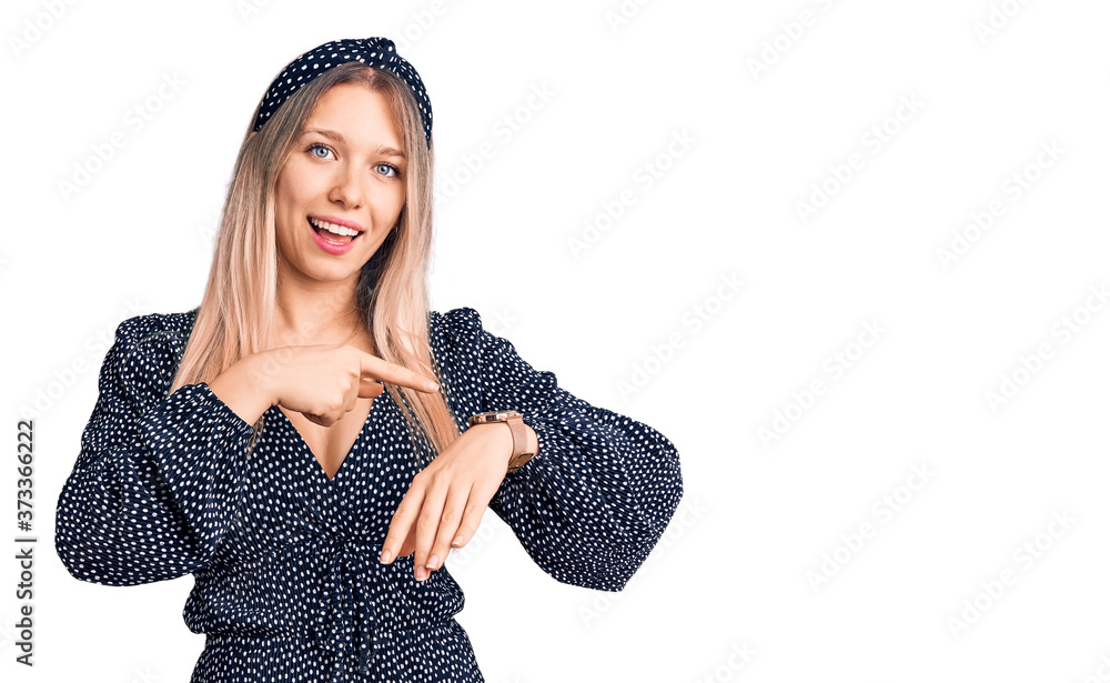 Young beautiful blonde woman wearing casual clothes in hurry pointing to watch time, impatience, upset and angry for deadline delay Young beautiful blonde woman wearing casual clothes in hurry pointing to watch time, impatience, upset and angry for deadline delay