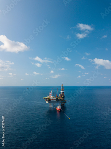 Aerial view from a drone of an offshore jack up rig at the offshore location during day time