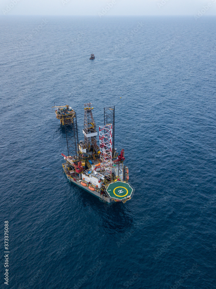 Aerial view from a drone of an offshore jack up rig at the offshore location during rig move