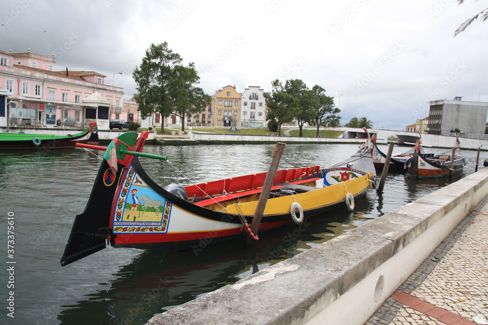 Traditional boats, Colorful Moliceiro boat, on the canal in Aveiro, Portugal.