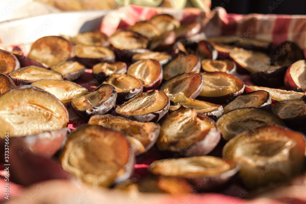 many semi-dried plums - close up selective focus many semi-dried plums - close up selective focus