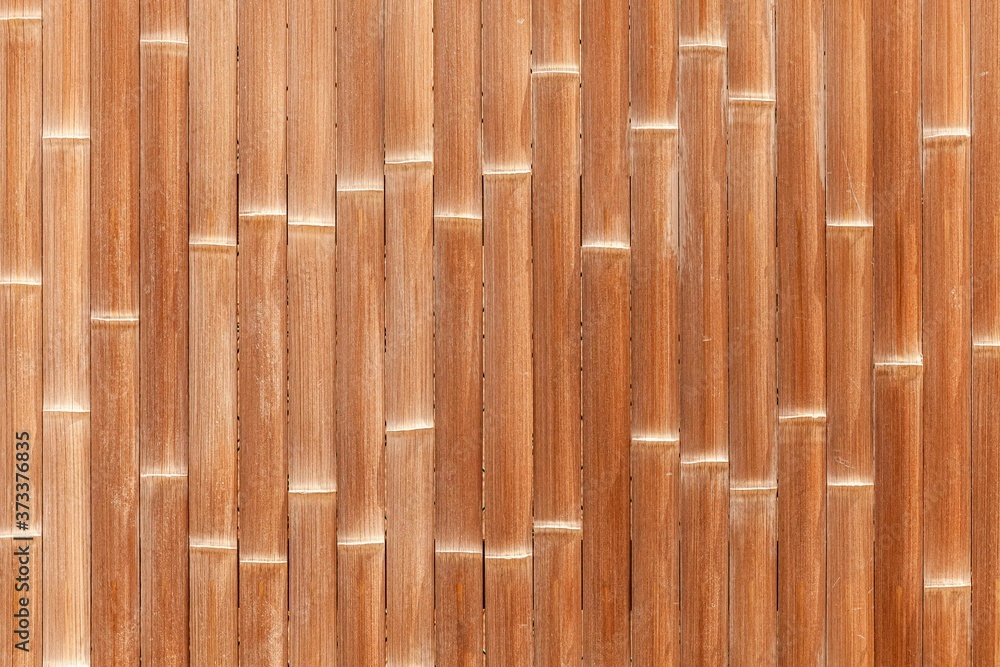 Fototapeta premium Bamboo wall or Bamboo fence texture. Old brown tone natural bamboo fence texture background