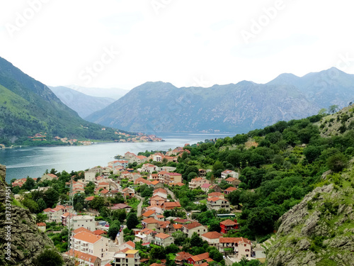 Aerial view of Kotor bay and old city in Kotor, Montenegro. Kotor is a coastal town in a secluded Gulf of Kotor, its preserved medieval old town is an UNESCO World Heritage Site.  © isparklinglife
