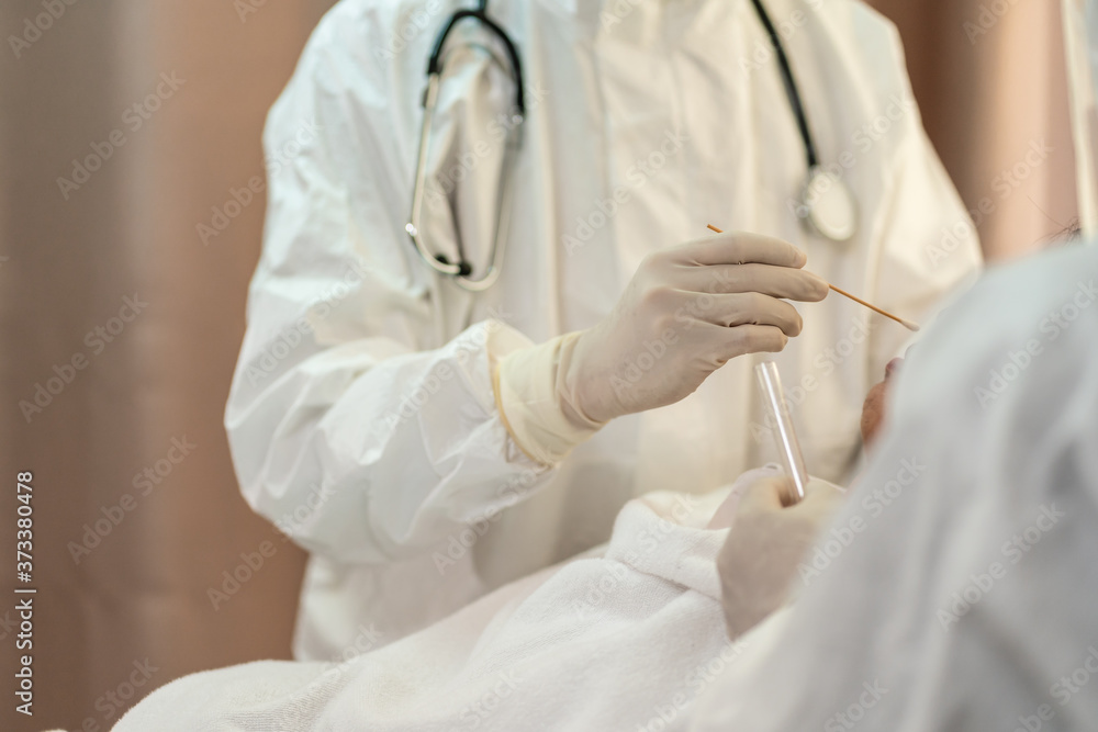 Doctor in PPE suit,face mask,shield,glove swab test Covid 19 patient Doctor in PPE suit,face mask,shield,glove swab test Covid 19 patient