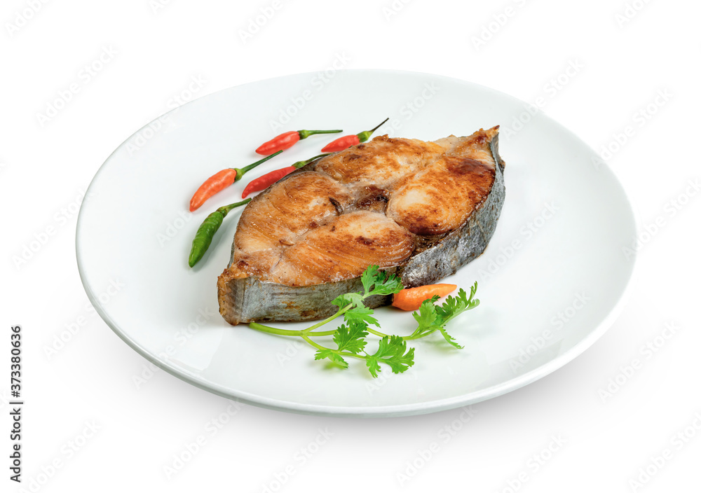 King mackerel or spotted mackerels steak with dish isolated on white background ,fried Scomberomorus fish ,include clipping path King mackerel or spotted mackerels steak with dish isolated on white background ,fried Scomberomorus fish ,include clipping path