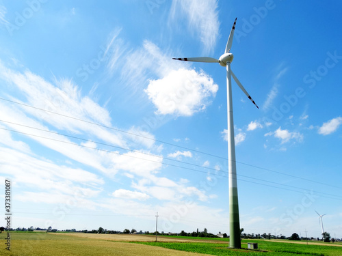 Landscape of farm and Wind turbine in field in summer season in Eastern Europe. photo
