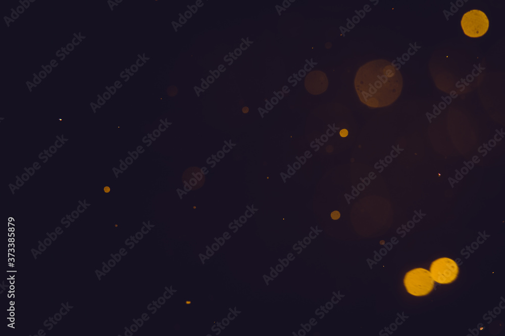 Dark Abstract Gold bokeh sparkle on black background Dark Abstract Gold bokeh sparkle on black background