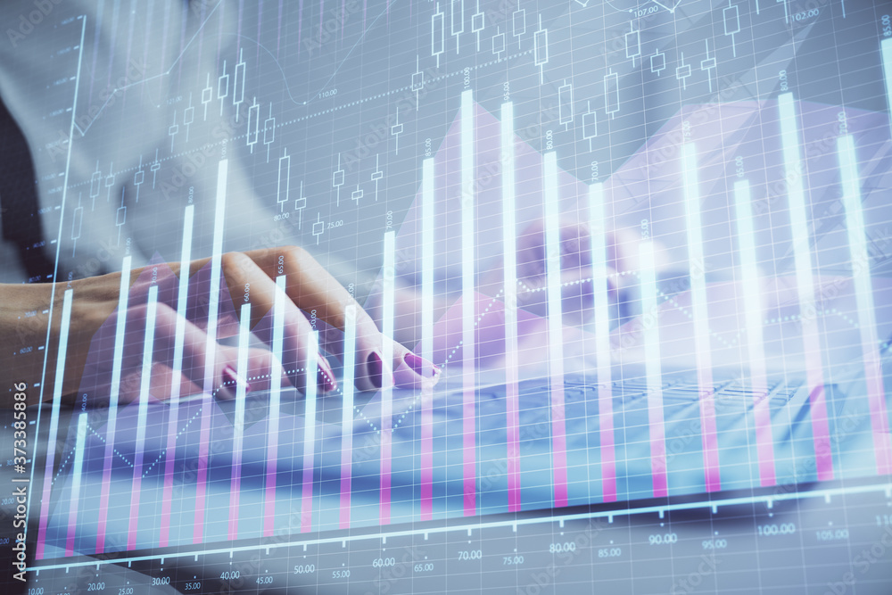 Multi exposure of woman hands typing on computer and financial graph hologram drawing. Stock market analysis concept. Multi exposure of woman hands typing on computer and financial graph hologram drawing. Stock market analysis concept.