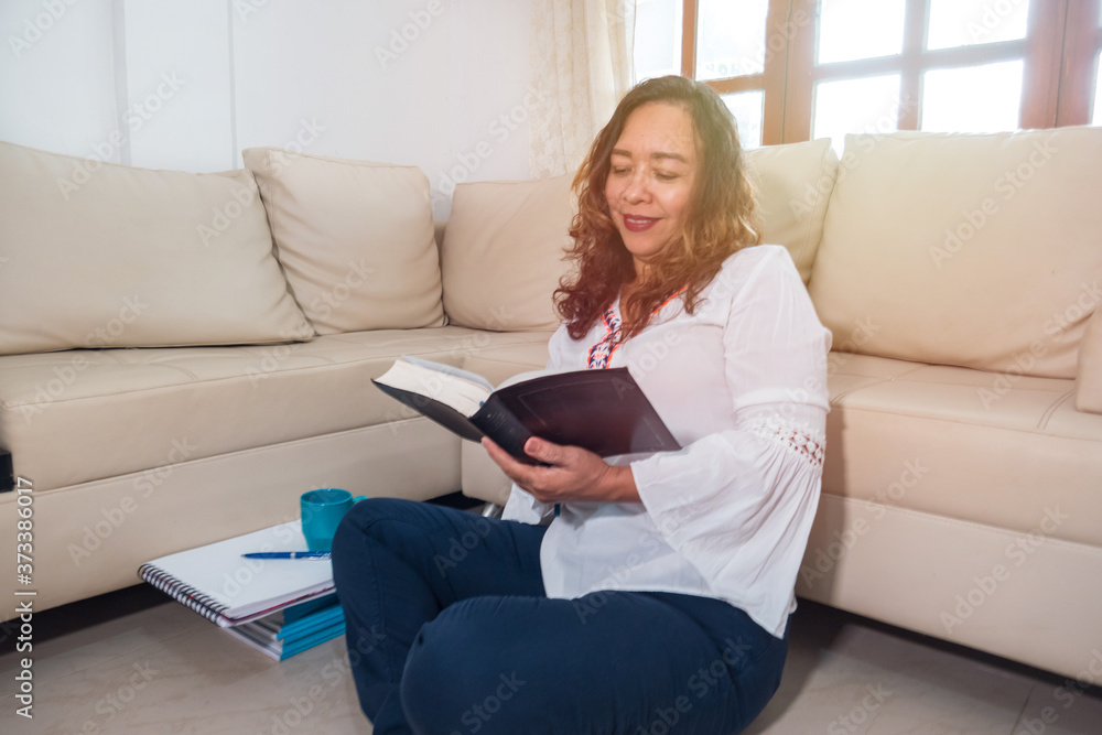 Mature woman reading in home Mature woman reading in home