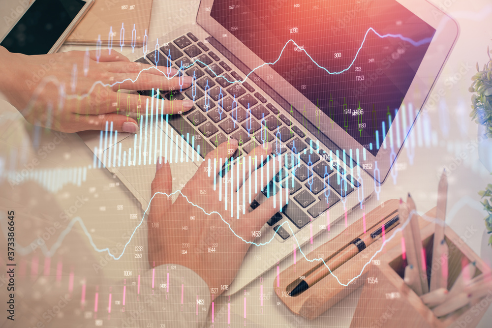 Multi exposure of woman hands typing on computer and forex chart hologram drawing. Stock market analysis concept. Multi exposure of woman hands typing on computer and forex chart hologram drawing. Stock market analysis concept.