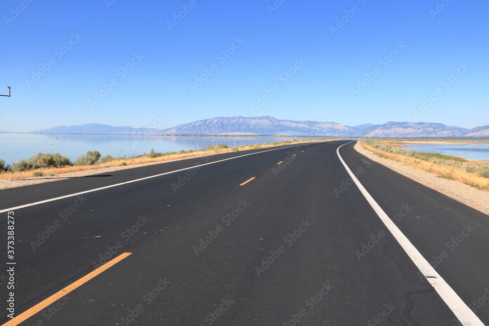 Antelope Island Causeway across the Great Salt Lake towards Wasatch Mountain Range in the East Antelope Island Causeway across the Great Salt Lake towards Wasatch Mountain Range in the East