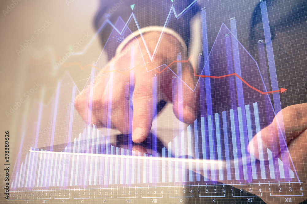 Multi exposure of man's hands holding and using a phone and financial chart drawing. Market analysis concept. Multi exposure of man's hands holding and using a phone and financial chart drawing. Market analysis concept.
