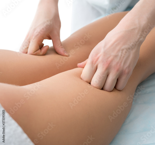 Cropped view of a woman being massaged in spa