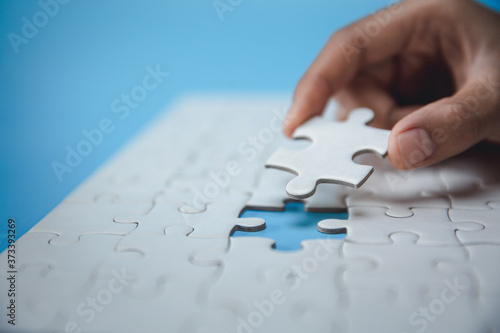 Hand connect jigsaw parts with word problem & solution. symbol of association and connection. business strategy. Teamwork concept.