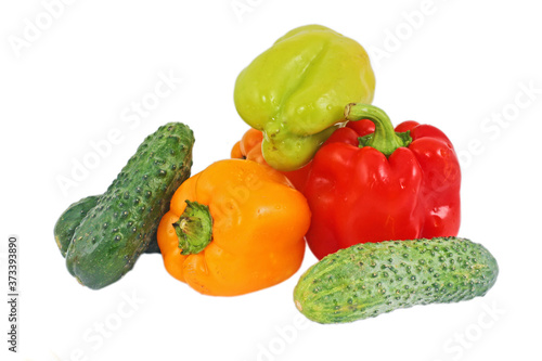 Fresh bright vegetables: papriks, tomato and cucumbers photo