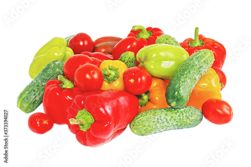 Fresh bright vegetables: papriks, tomato and cucumbers photo