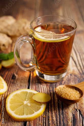 Lemon ginner tea with sliced fresh lemon and honey sugar