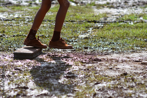 walking step over the dirt ground. © noombkk