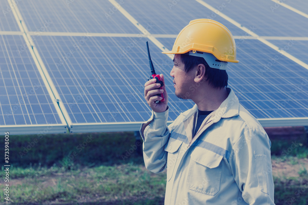 engineer or electrician working on maintenance equipment at industry solar power engineer or electrician working on maintenance equipment at industry solar power