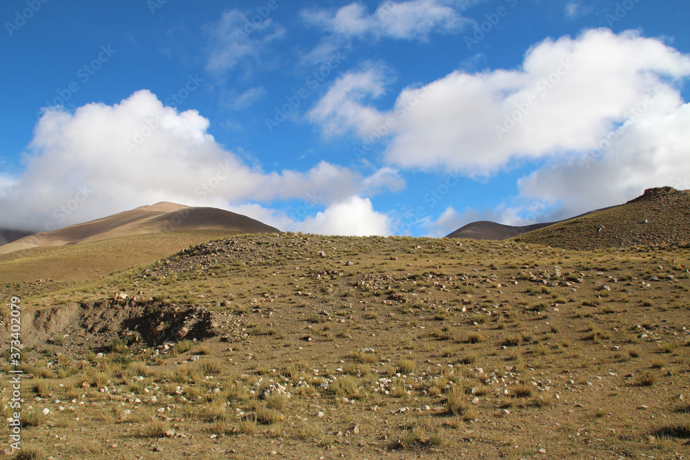 View of the mountain with the blue sky and white clouds in Tibet, China