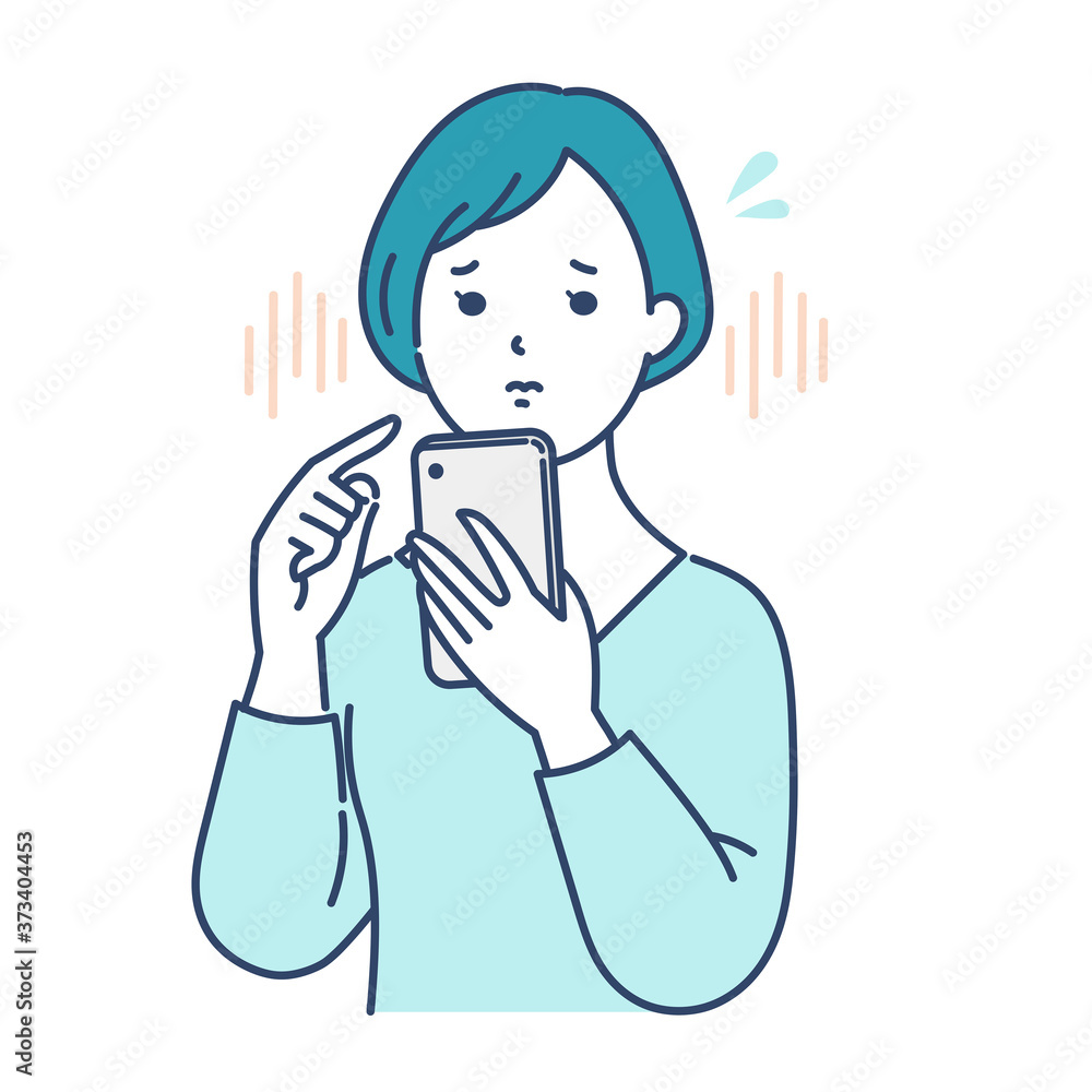スマホを見て不安になる女性 スマホを見て不安になる女性