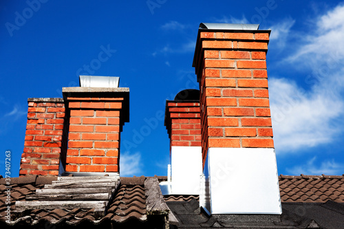 several brick chimneys on old houses in Skelleftea photo