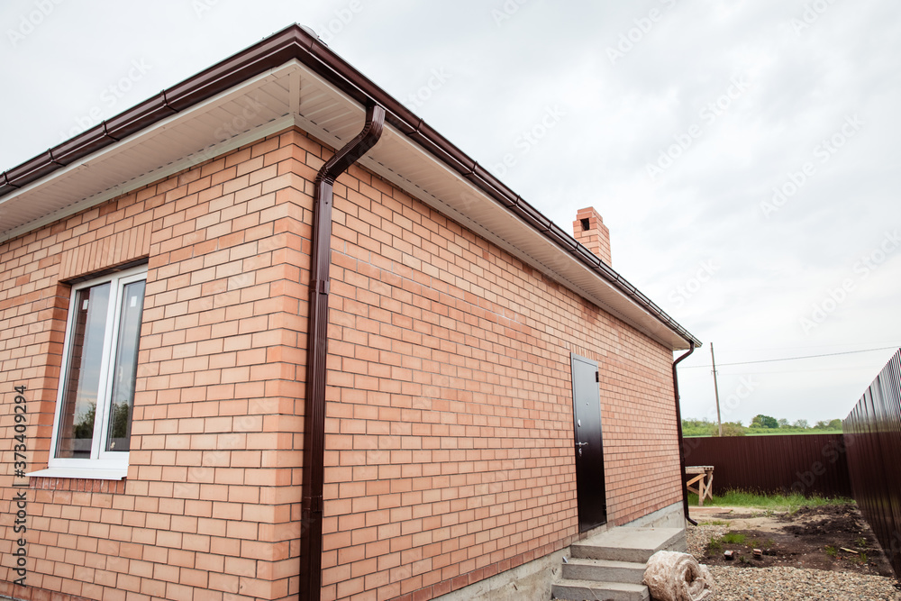 Brick house Wall Facade. construction of houses. cottage red brick house