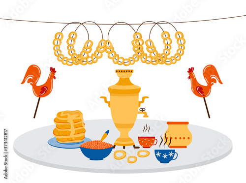 Traditional Russian food on table spread - samovar with tea cups and dinner elements