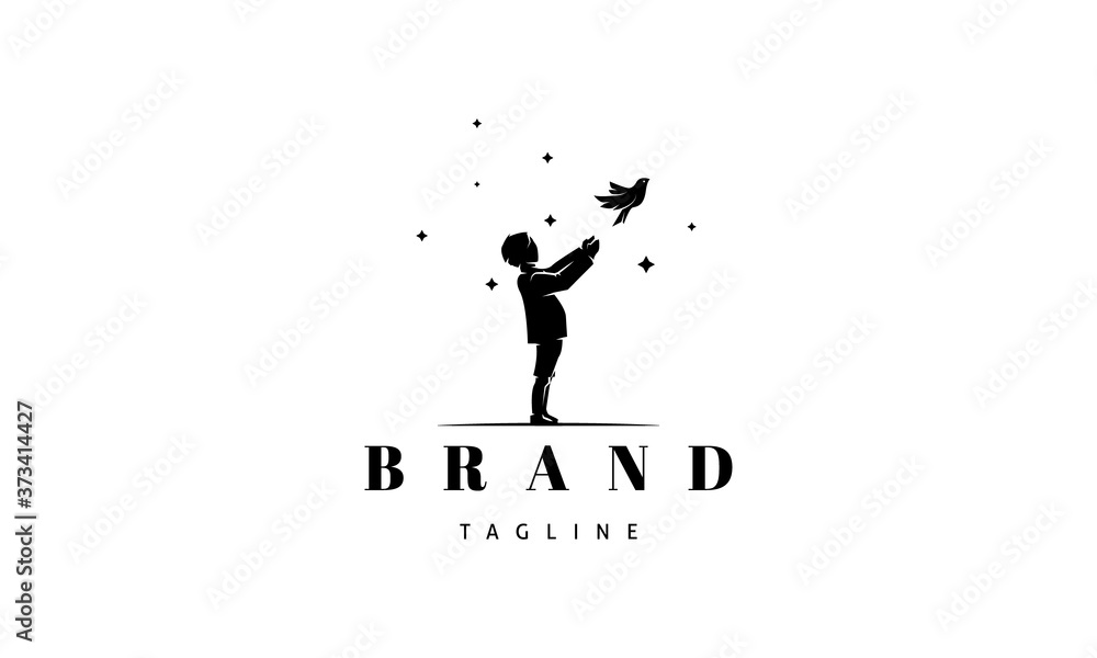 Vector logo on which an abstract image of a silhouette of a boy releasing a bird on the background of stars.