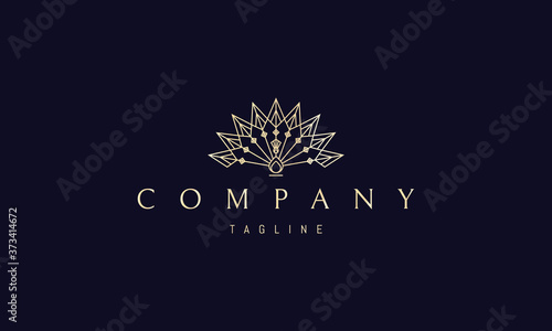 Vector golden logo on which an abstract image of a peacock in a linear style.