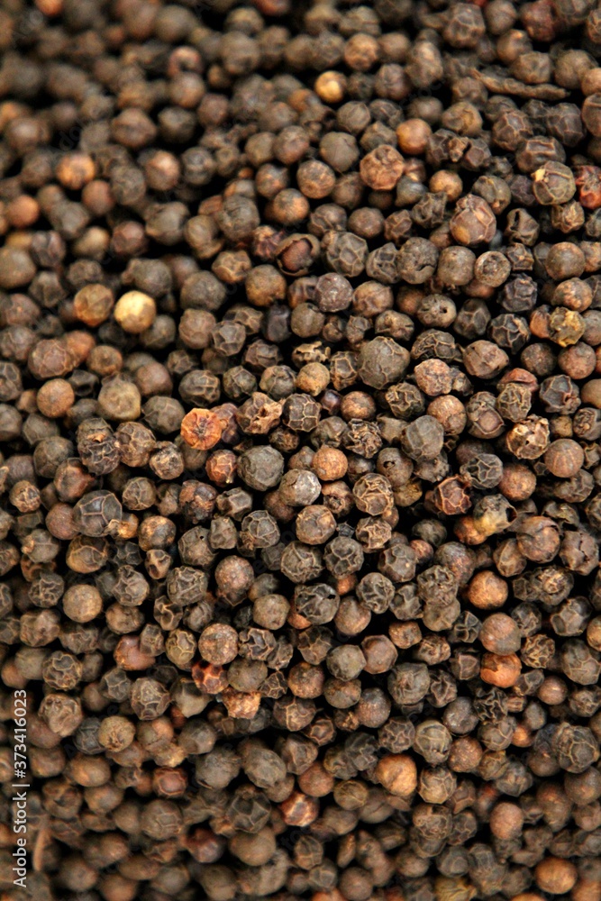 black pepper seeds close up, could be used like the background black pepper seeds close up, could be used like the background