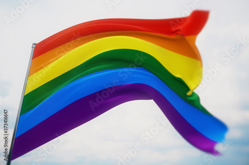 3D illustration. The rainbow flag, LGBT pride flag or gay pride flag waving at wind. Shot with a shallow depth of field, selective focus.