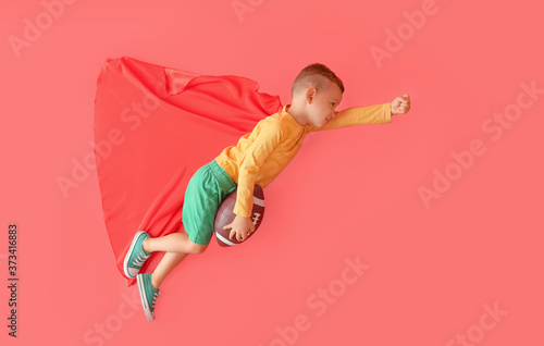 Little boy with rugby ball ...