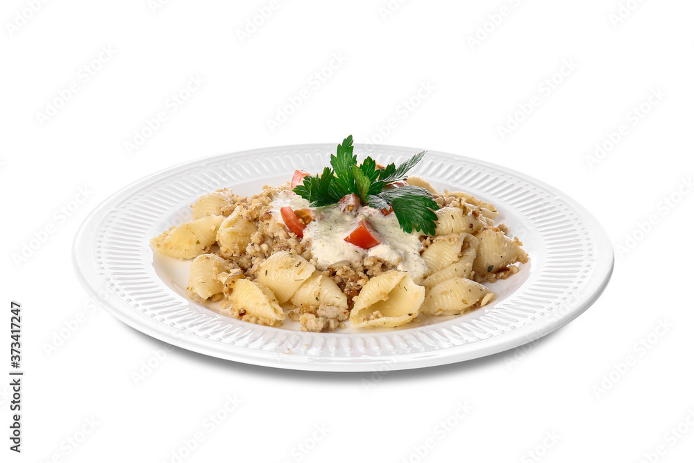 Plate with tasty conchiglie pasta on white background Plate with tasty conchiglie pasta on white background