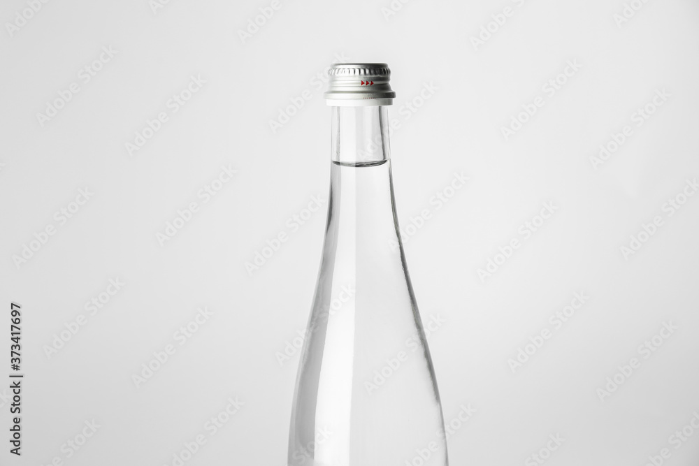 Bottle of clean water on light background Bottle of clean water on light background