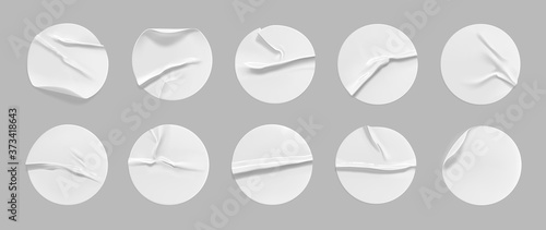 White round crumpled sticker mock up set. Adhesive white paper or plastic sticker label with glued, wrinkled effect on gray background. Blank templates of a label or price tags. 3d realistic vector