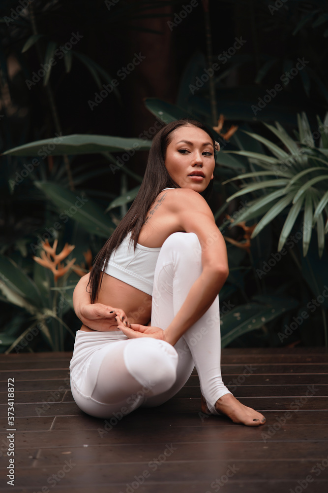 Asia Yoga instructor, in outdoor exercise. Portrait of gorgeous asian young woman practicing yoga outdoor