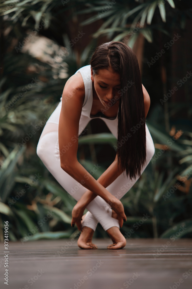 Asia Yoga instructor, in outdoor exercise. Portrait of gorgeous asian young woman practicing yoga outdoor