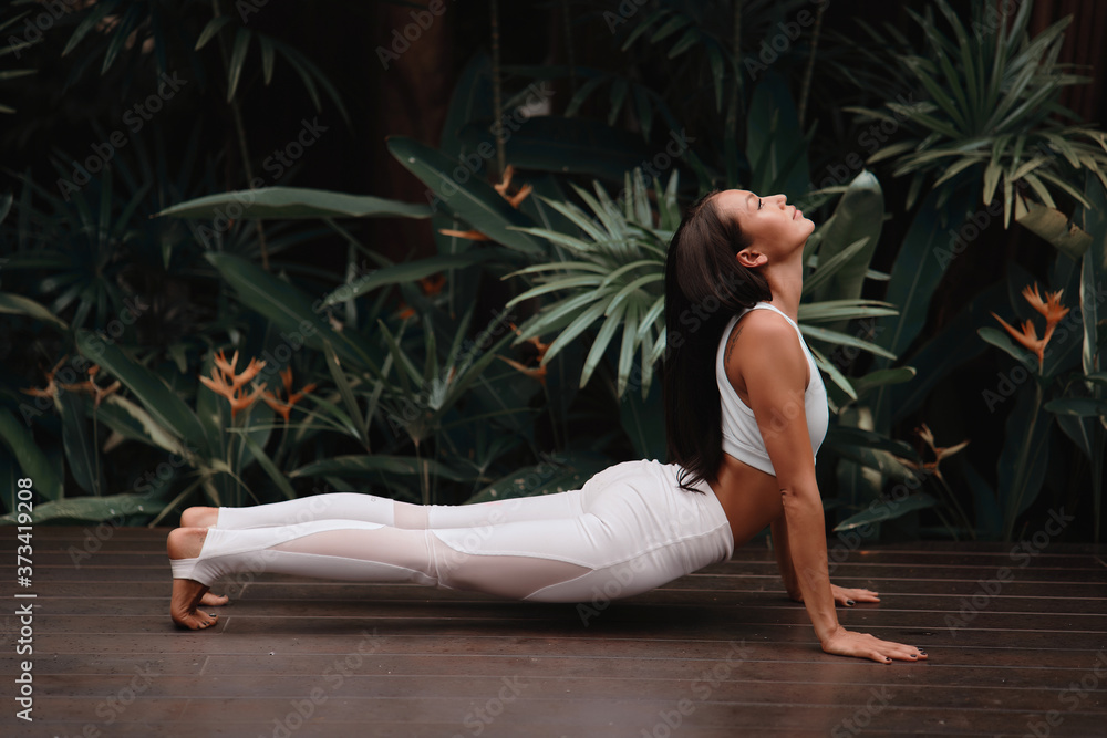 Asia Yoga instructor, in outdoor exercise. Portrait of gorgeous asian young woman practicing yoga outdoor